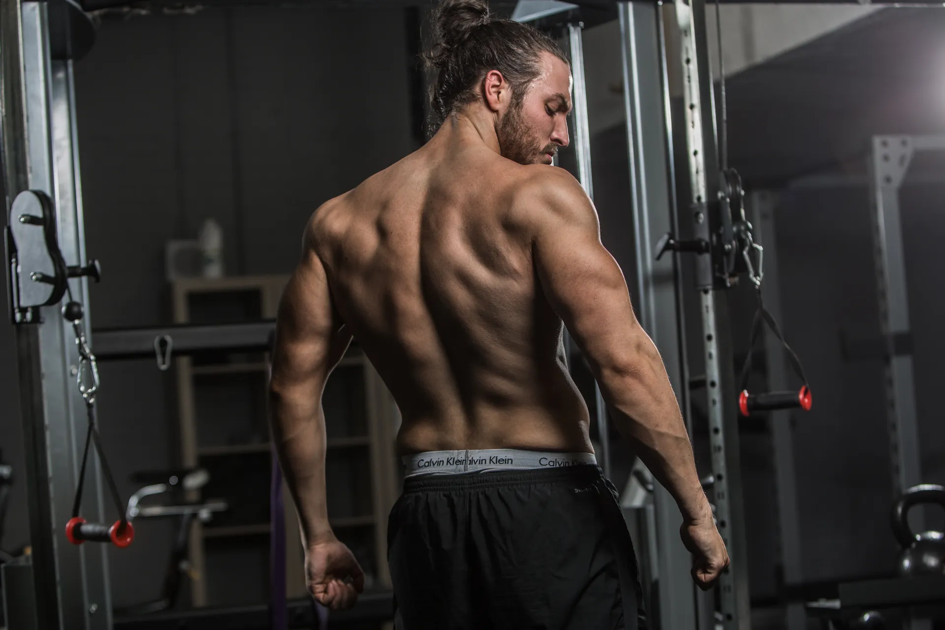 Evolve trainer coaching a client through a strength movement